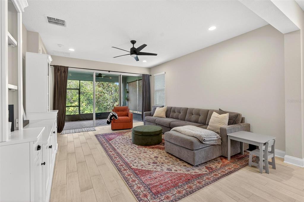 2139 Bay Line Road Oakland, FL 34787 - Photo 15 of 57 a living room with furniture and a large window