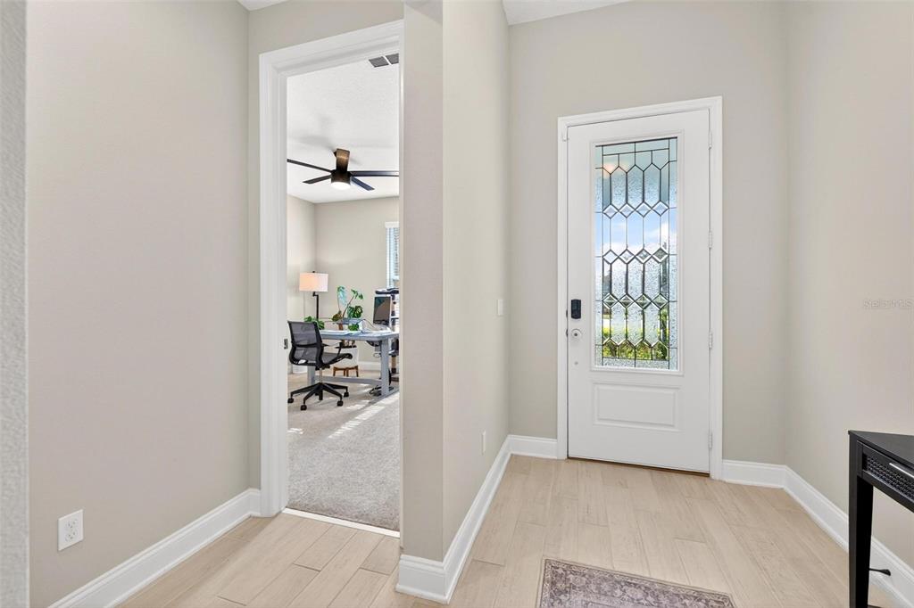 2139 Bay Line Road Oakland, FL 34787 - Photo 17 of 57 a view of a hallway with white walls and cabinet
