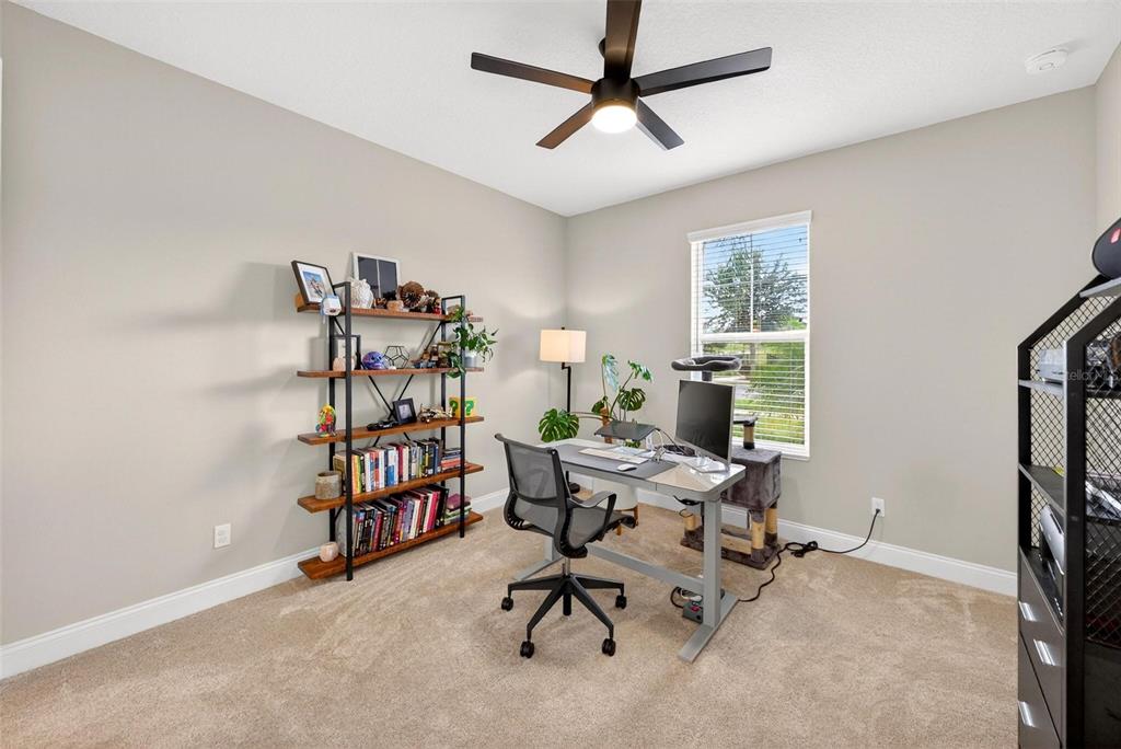 2139 Bay Line Road Oakland, FL 34787 - Photo 18 of 57 a view of a workspace with furniture and a window