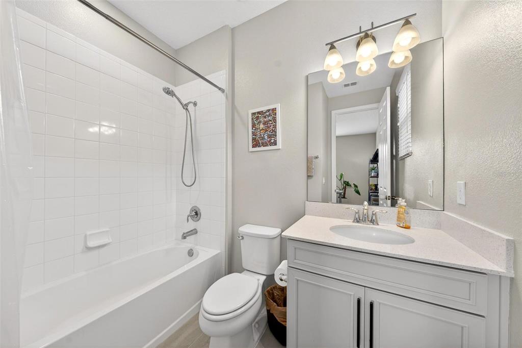 2139 Bay Line Road Oakland, FL 34787 - Photo 21 of 57 a bathroom with a sink a toilet and shower