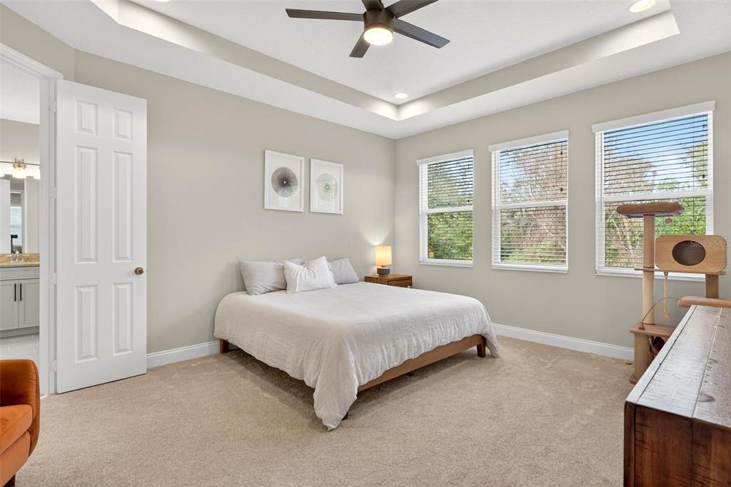 2139 Bay Line Road Oakland, FL 34787 - Photo 22 of 57 a bedroom with a bed and a window