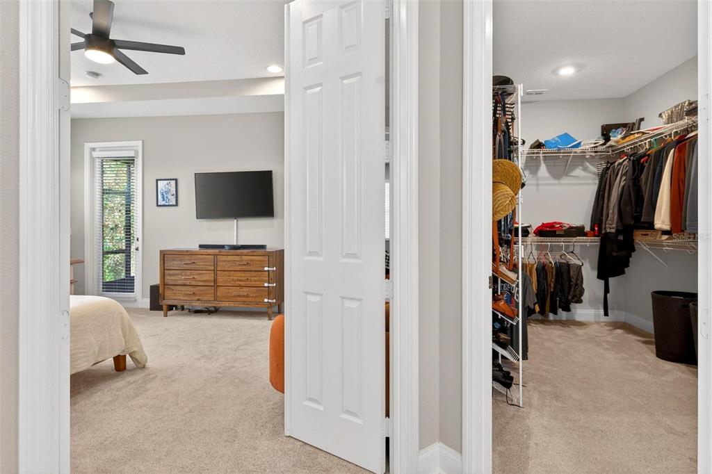 2139 Bay Line Road Oakland, FL 34787 - Photo 25 of 57 a view of walk in closet with clothes and shoes