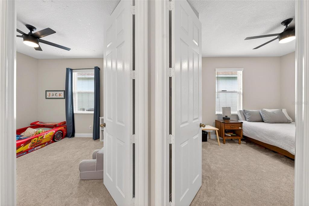2139 Bay Line Road Oakland, FL 34787 - Photo 32 of 57 a living room with furniture and a chandelier