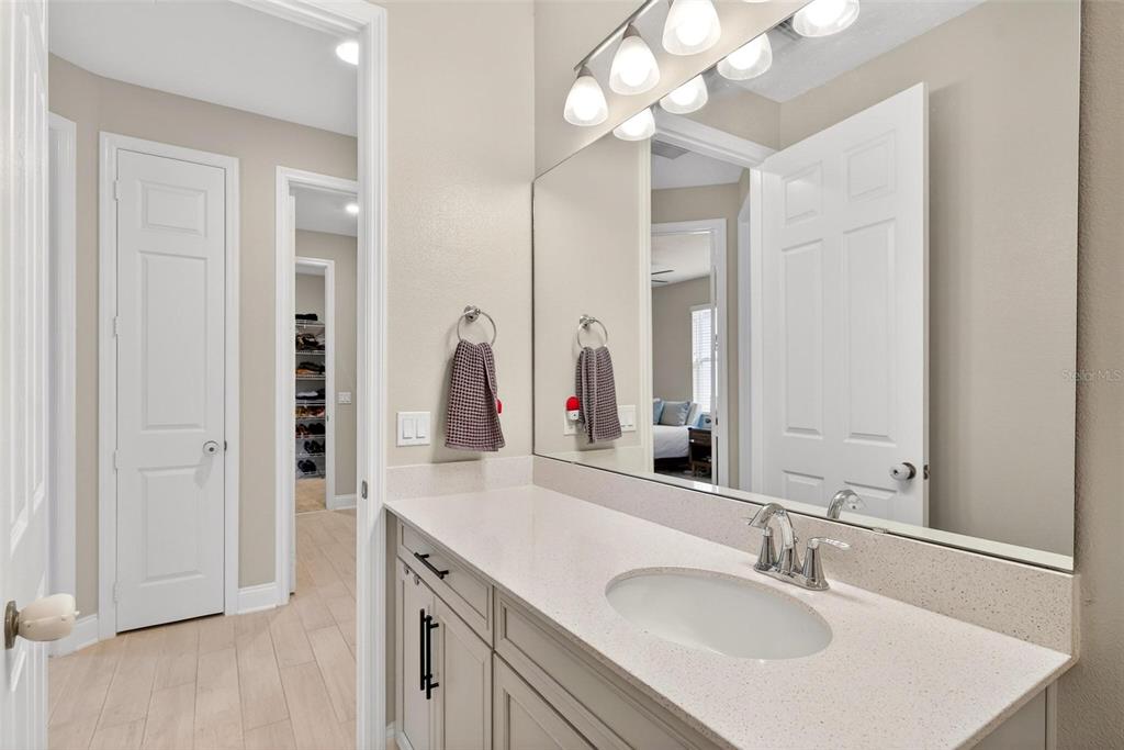 2139 Bay Line Road Oakland, FL 34787 - Photo 37 of 57 a bathroom with a sink vanity and a mirror