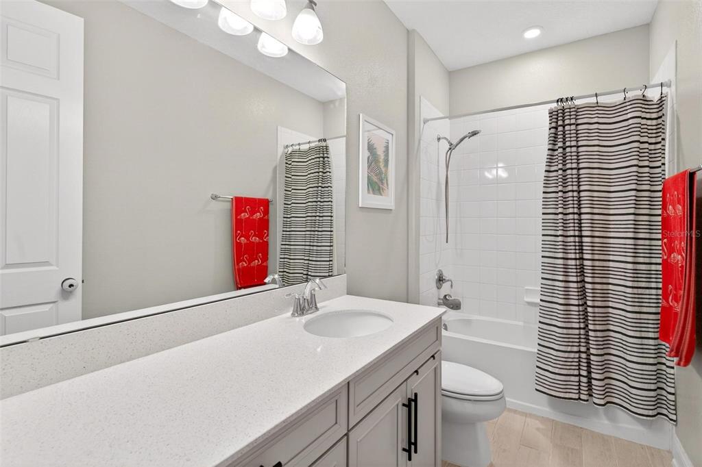 2139 Bay Line Road Oakland, FL 34787 - Photo 38 of 57 a bathroom with a sink a toilet and shower