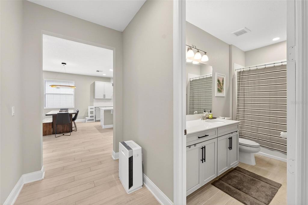 2139 Bay Line Road Oakland, FL 34787 - Photo 39 of 57 a spacious bathroom with a granite countertop sink and a mirror