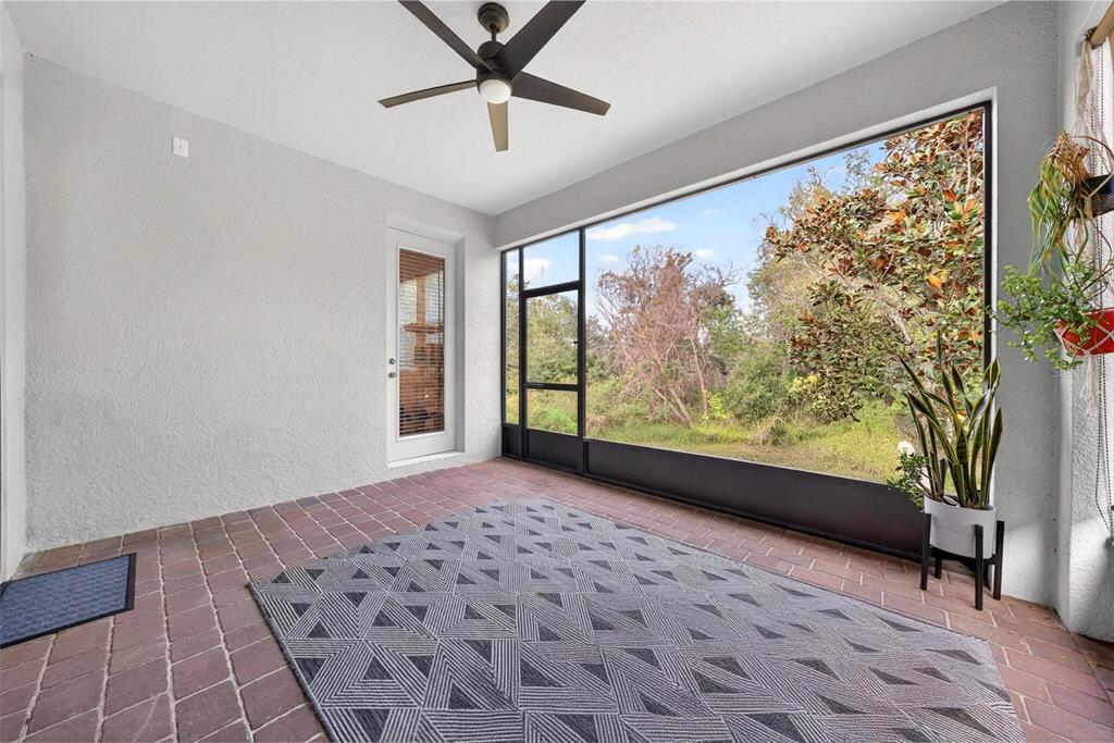 2139 Bay Line Road Oakland, FL 34787 - Photo 41 of 57 a view of a big room with wooden floor and windows