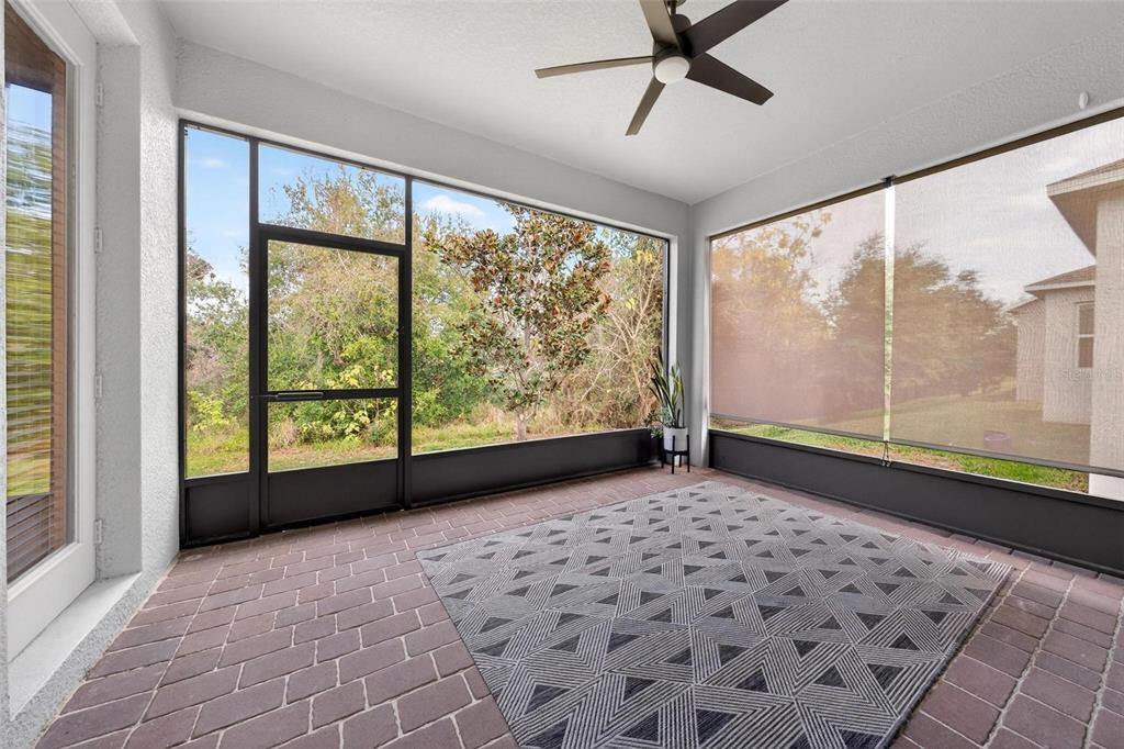 2139 Bay Line Road Oakland, FL 34787 - Photo 42 of 57 a view of a big room with wooden floor and windows