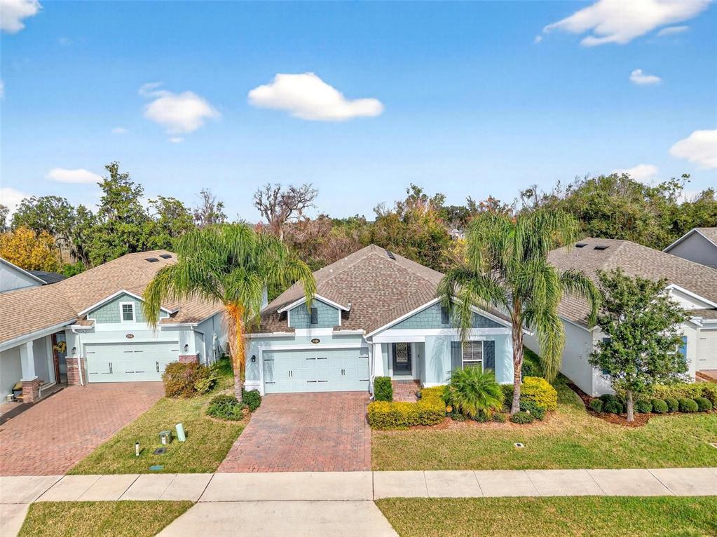 2139 Bay Line Road Oakland, FL 34787 - Photo 57 of 57 a front view of a house with a garden