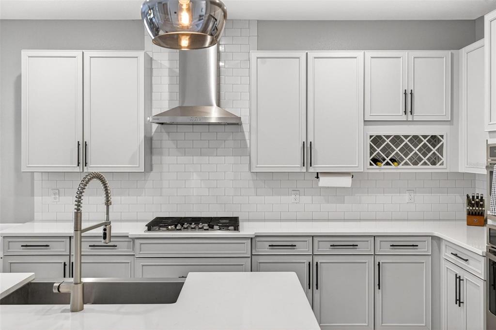 2139 Bay Line Road Oakland, FL 34787 - Photo 7 of 57 a kitchen with appliances a sink and cabinets
