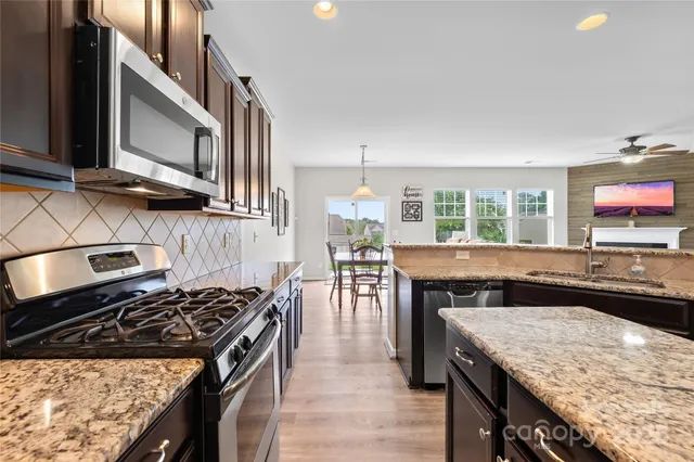 a kitchen with a stove and a sink