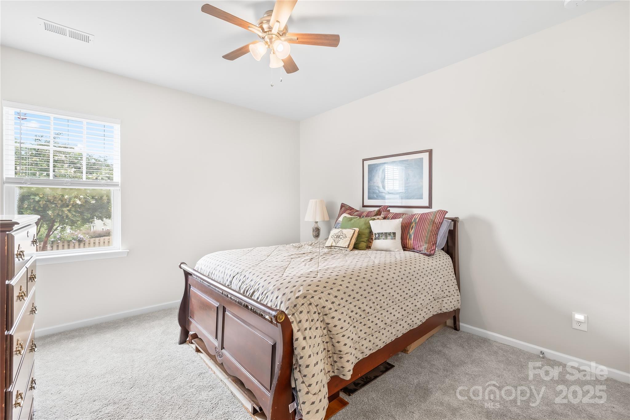1858 Caprington Drive Fort Mill, SC 29707 - Photo 22 of 46 a bedroom with a bed and a window