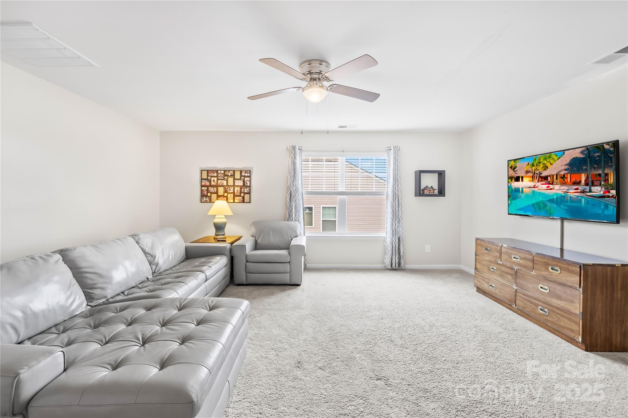 1858 Caprington Drive Fort Mill, SC 29707 - Photo 24 of 46 a living room with furniture and a flat screen tv