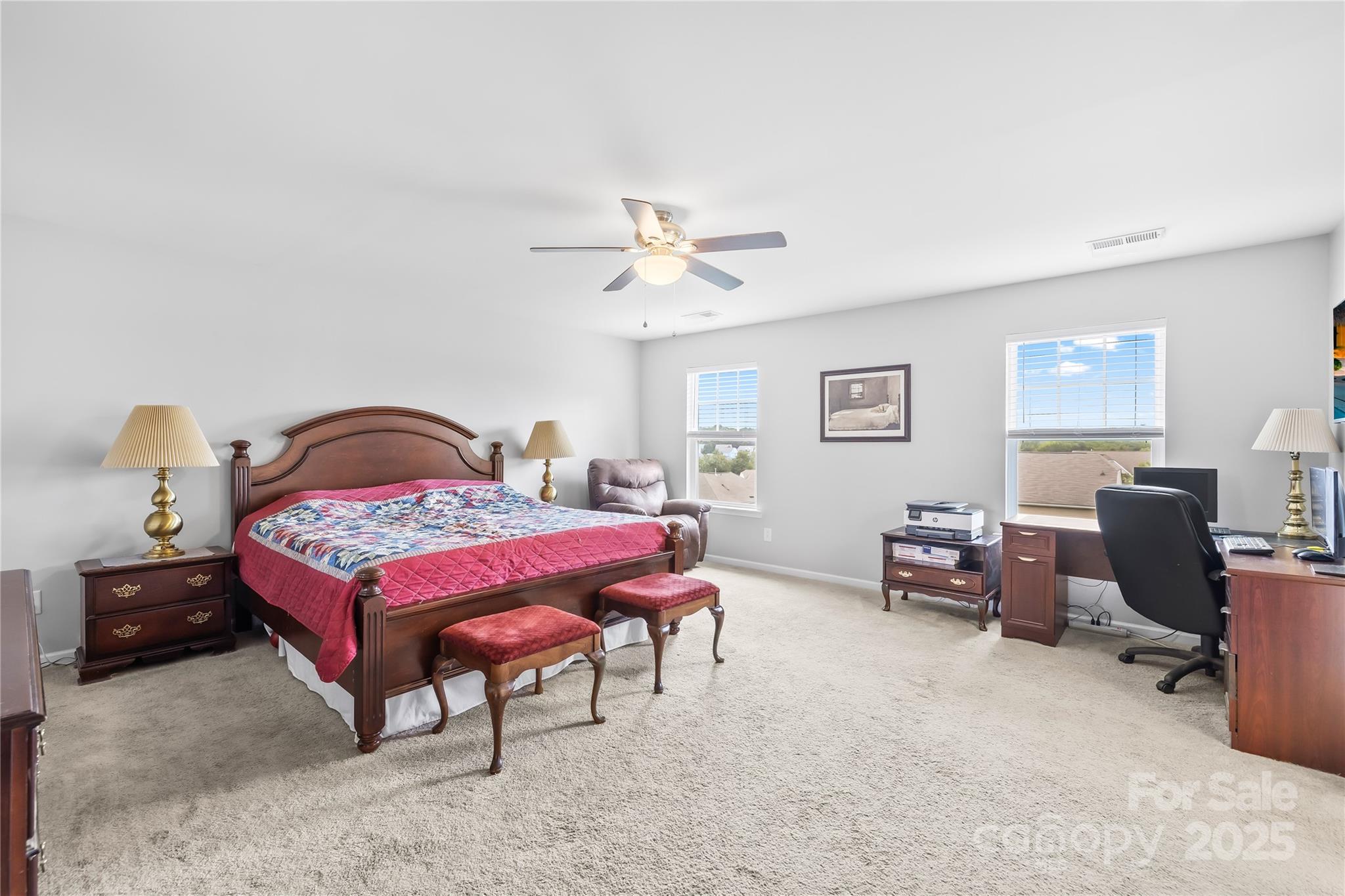 1858 Caprington Drive Fort Mill, SC 29707 - Photo 26 of 46 a bedroom with a bed and a chandelier