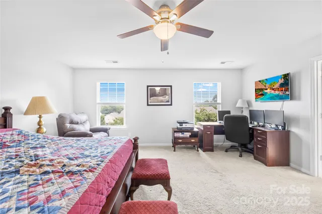 a bedroom with a bed and furniture