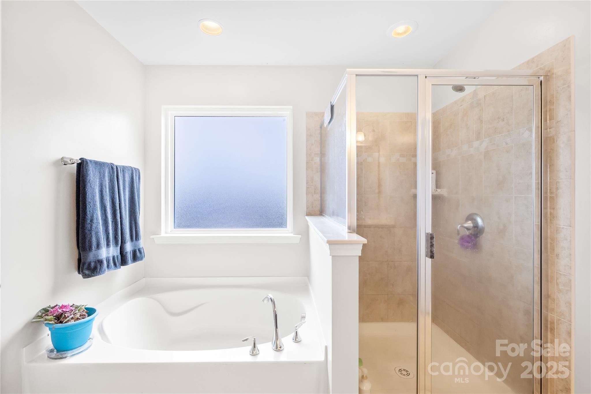 1858 Caprington Drive Fort Mill, SC 29707 - Photo 29 of 46 a bathroom with a tub and a shower