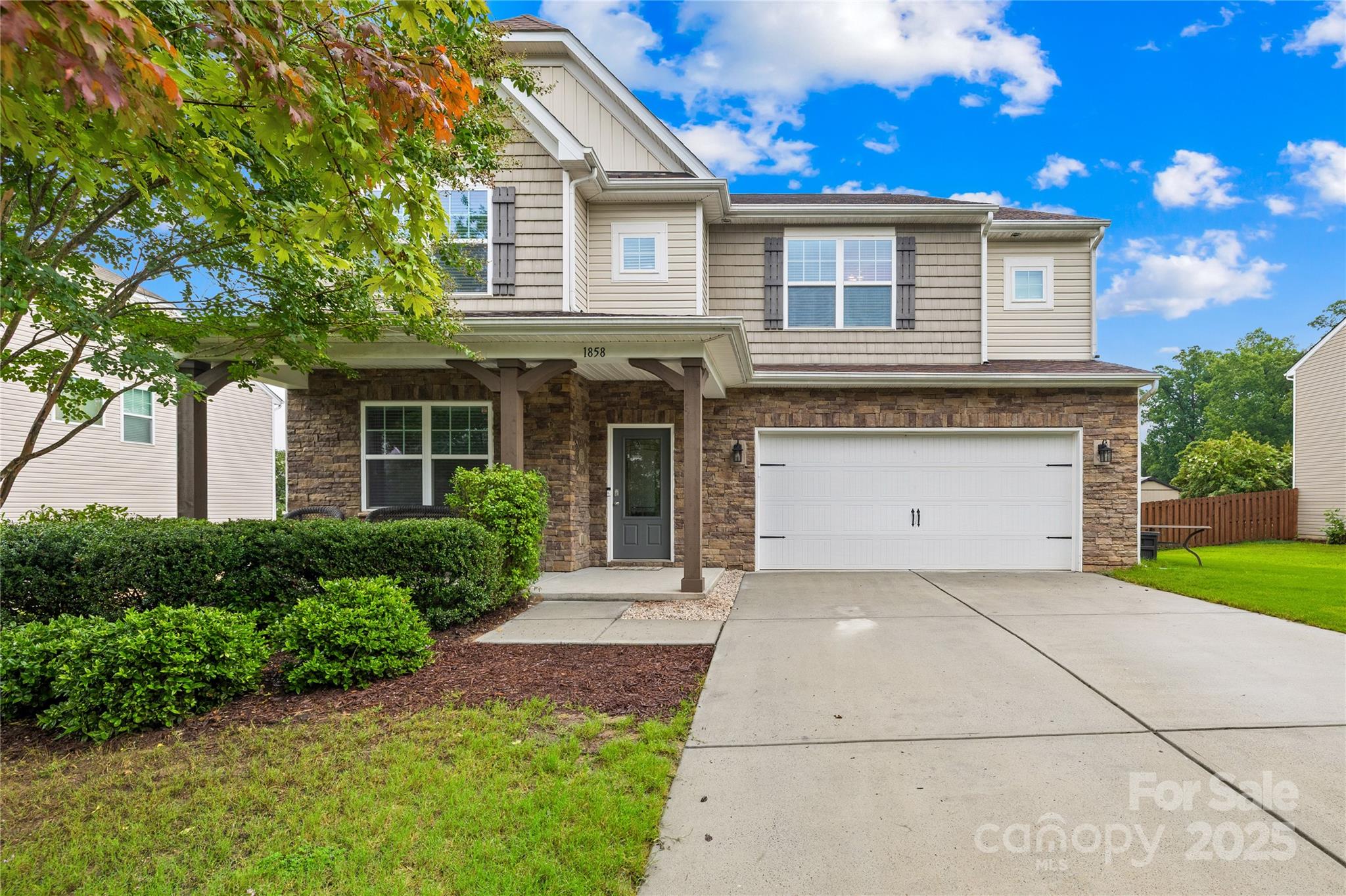 1858 Caprington Drive Fort Mill, SC 29707 - Photo 3 of 46 a front view of a house with a yard and garage