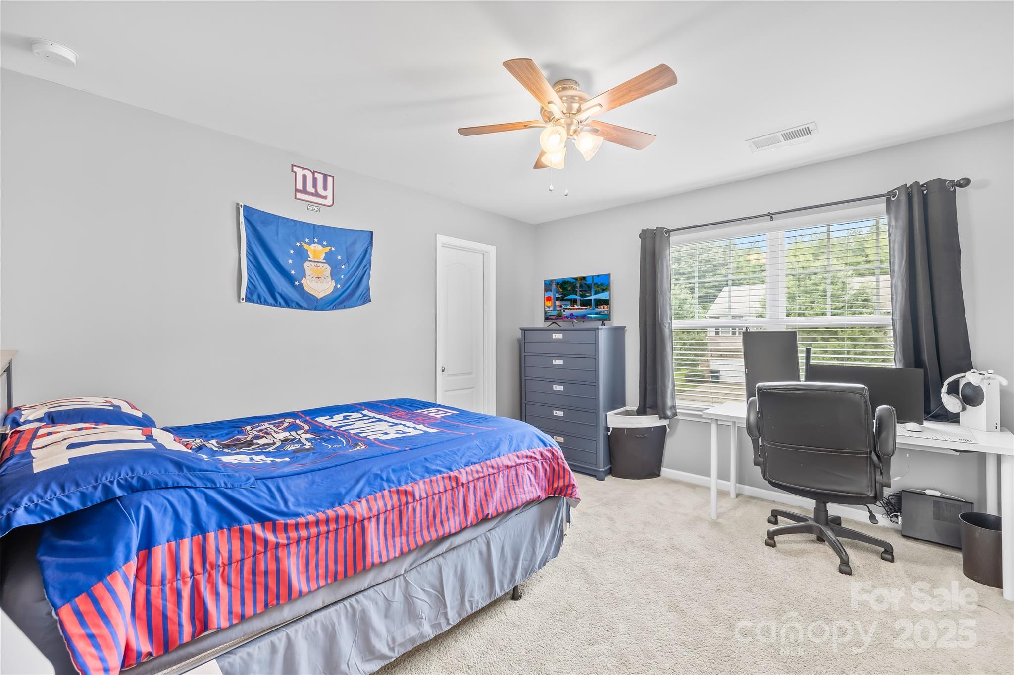 1858 Caprington Drive Fort Mill, SC 29707 - Photo 33 of 46 a bedroom with a bed and a desk