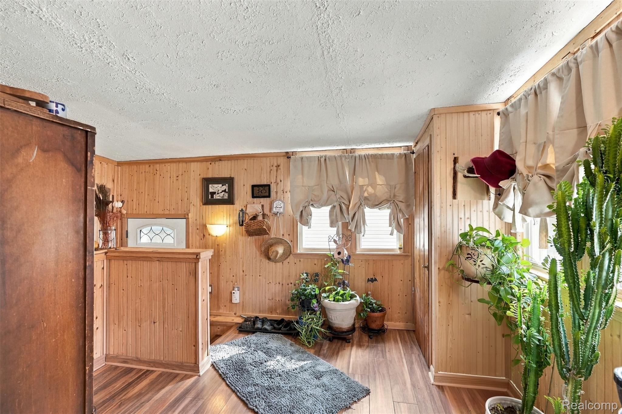 36739 Wick Road Romulus, MI 48174 - Photo 22 of 56 Wood-finish flooring with beadboard wall paneling