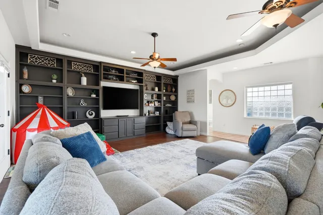 a view of a livingroom with furniture and a chandelier