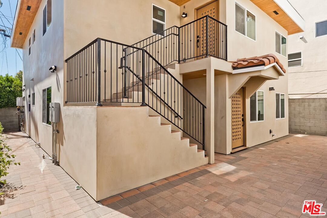 3431 Edgehill Drive Los Angeles, CA 90018 - Photo 12 of 17 a view of a house with many windows