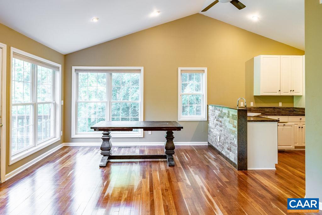 475 David Road Charlottesville, VA 22902 - Photo 11 of 38 a view of livingroom with furniture wooden floor and windows