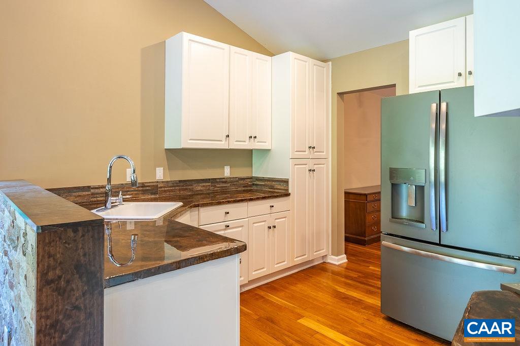 475 David Road Charlottesville, VA 22902 - Photo 12 of 38 a kitchen with stainless steel appliances granite countertop a refrigerator a sink and white cabinets