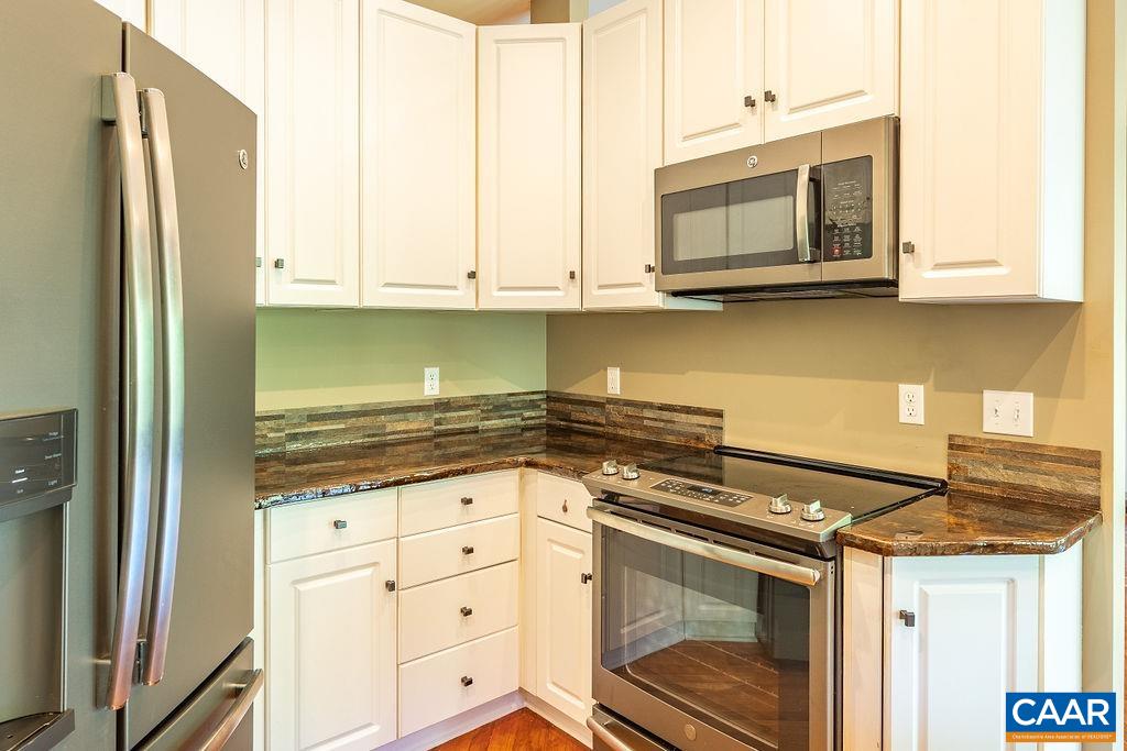 475 David Road Charlottesville, VA 22902 - Photo 13 of 38 a kitchen with stainless steel appliances granite countertop a stove and a microwave