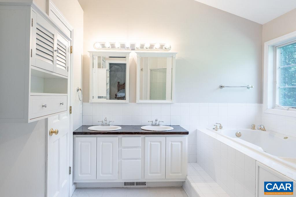 475 David Road Charlottesville, VA 22902 - Photo 17 of 38 a bathroom with a sink and a mirror