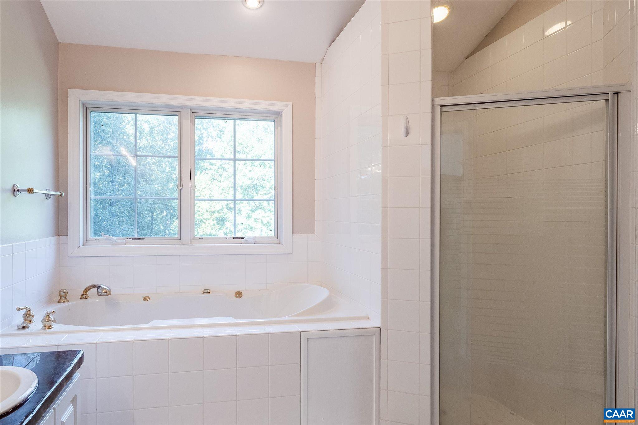 475 David Road Charlottesville, VA 22902 - Photo 18 of 38 a white bath tub sitting next to a window