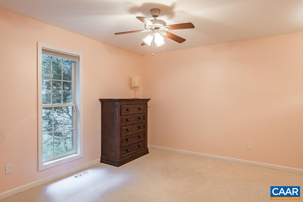 475 David Road Charlottesville, VA 22902 - Photo 19 of 38 an empty room with windows and fan