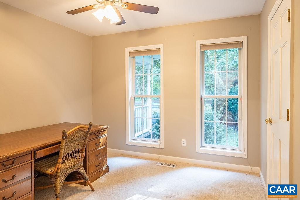 475 David Road Charlottesville, VA 22902 - Photo 21 of 38 a view of a workspace with furniture and a window