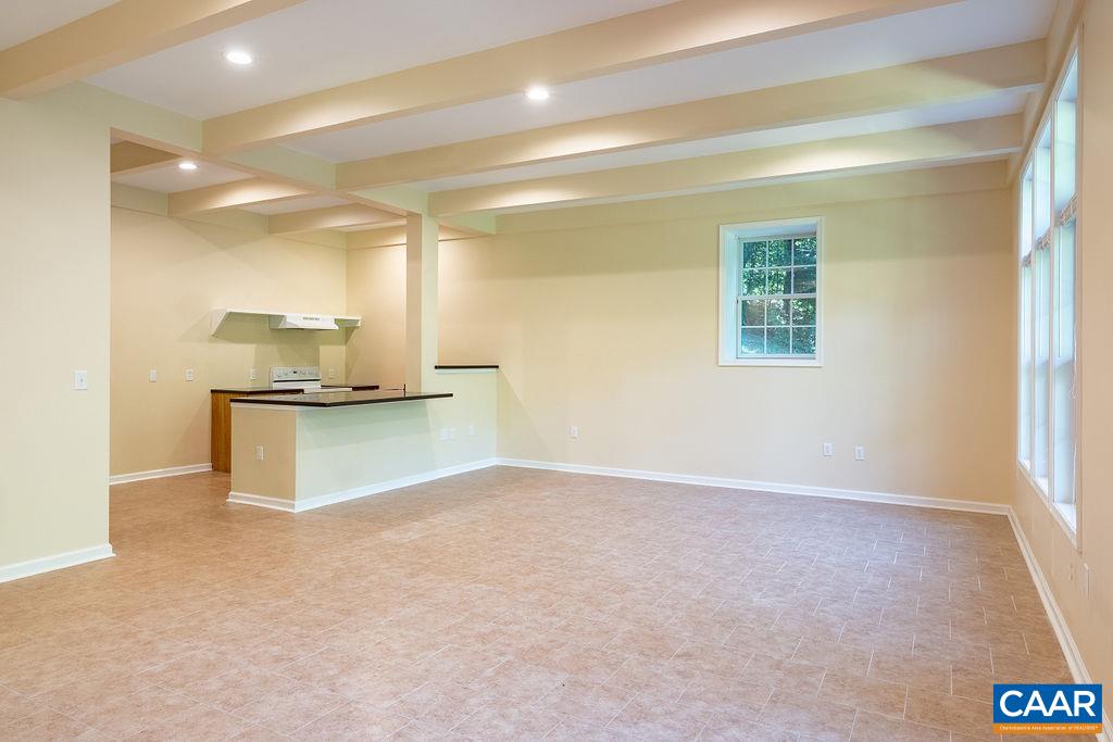 475 David Road Charlottesville, VA 22902 - Photo 27 of 38 a view of an empty room with kitchen and a window