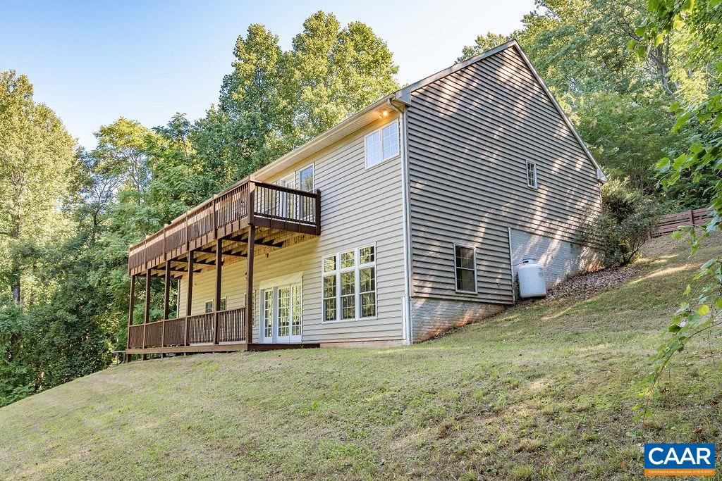 475 David Road Charlottesville, VA 22902 - Photo 32 of 38 a view of a house with a yard and wooden fence