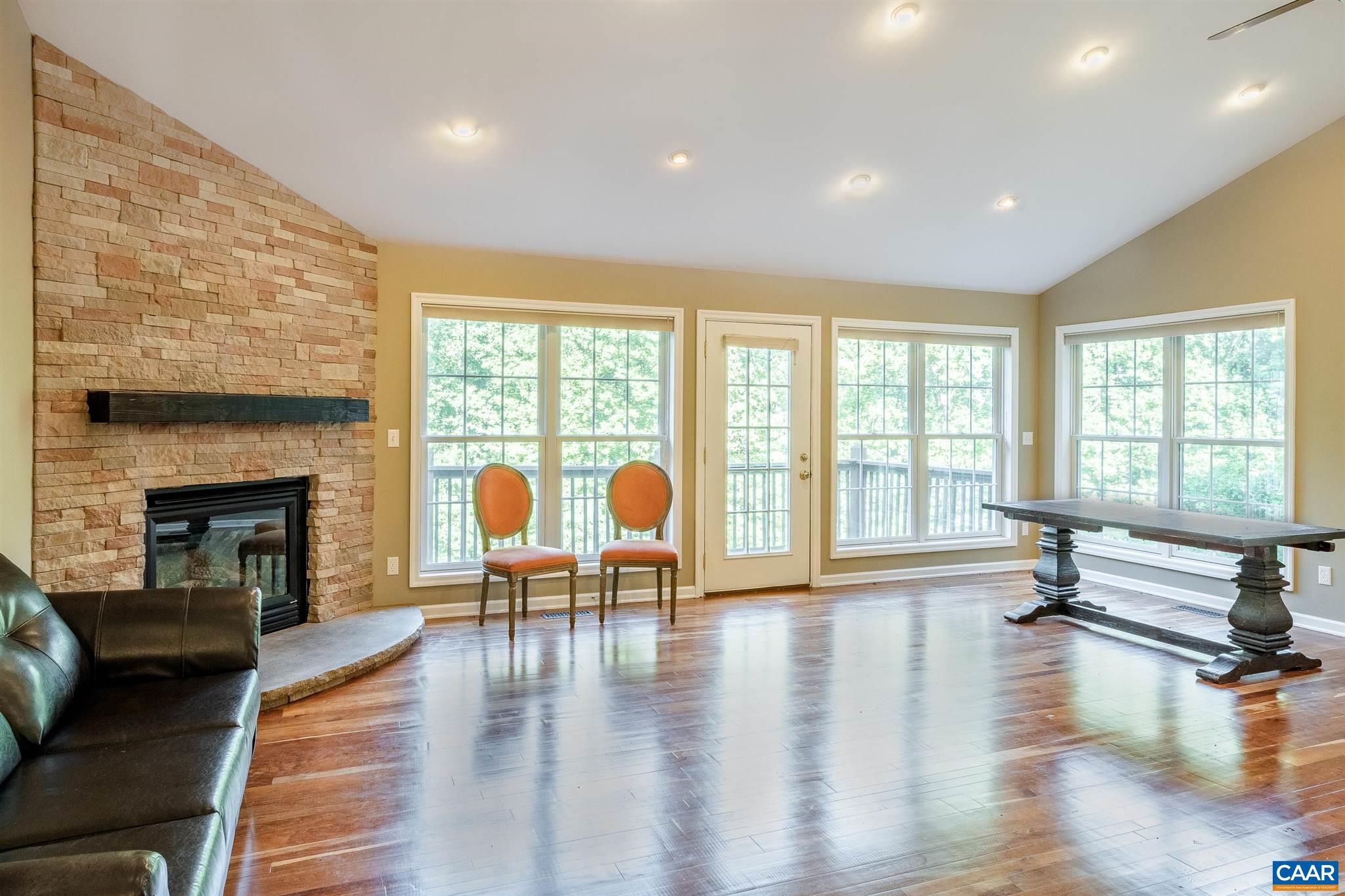 475 David Road Charlottesville, VA 22902 - Photo 9 of 38 a living room with furniture and a fireplace