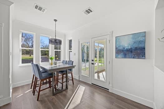 4147 Rench Road Fort Worth, TX 76135 - Photo 13 of 30 a view of a dining room with furniture window and wooden floor