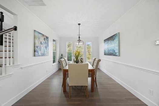4147 Rench Road Fort Worth, TX 76135 - Photo 14 of 30 a dining room with furniture a chandelier and wooden floor