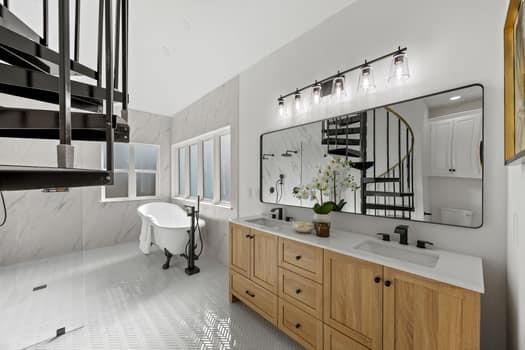 4147 Rench Road Fort Worth, TX 76135 - Photo 20 of 30 a spacious bathroom with a double vanity sink a mirror and a bathtub