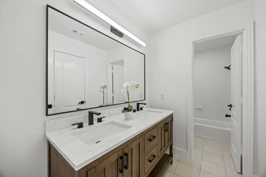 4147 Rench Road Fort Worth, TX 76135 - Photo 27 of 30 a bathroom with a sink and a mirror