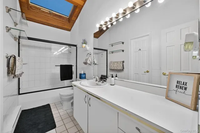 a bathroom with a sink a large mirror and a shower