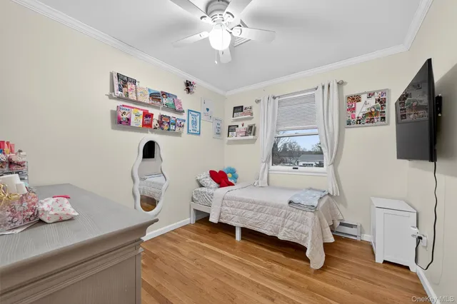 a bedroom with a bed and flat screen tv