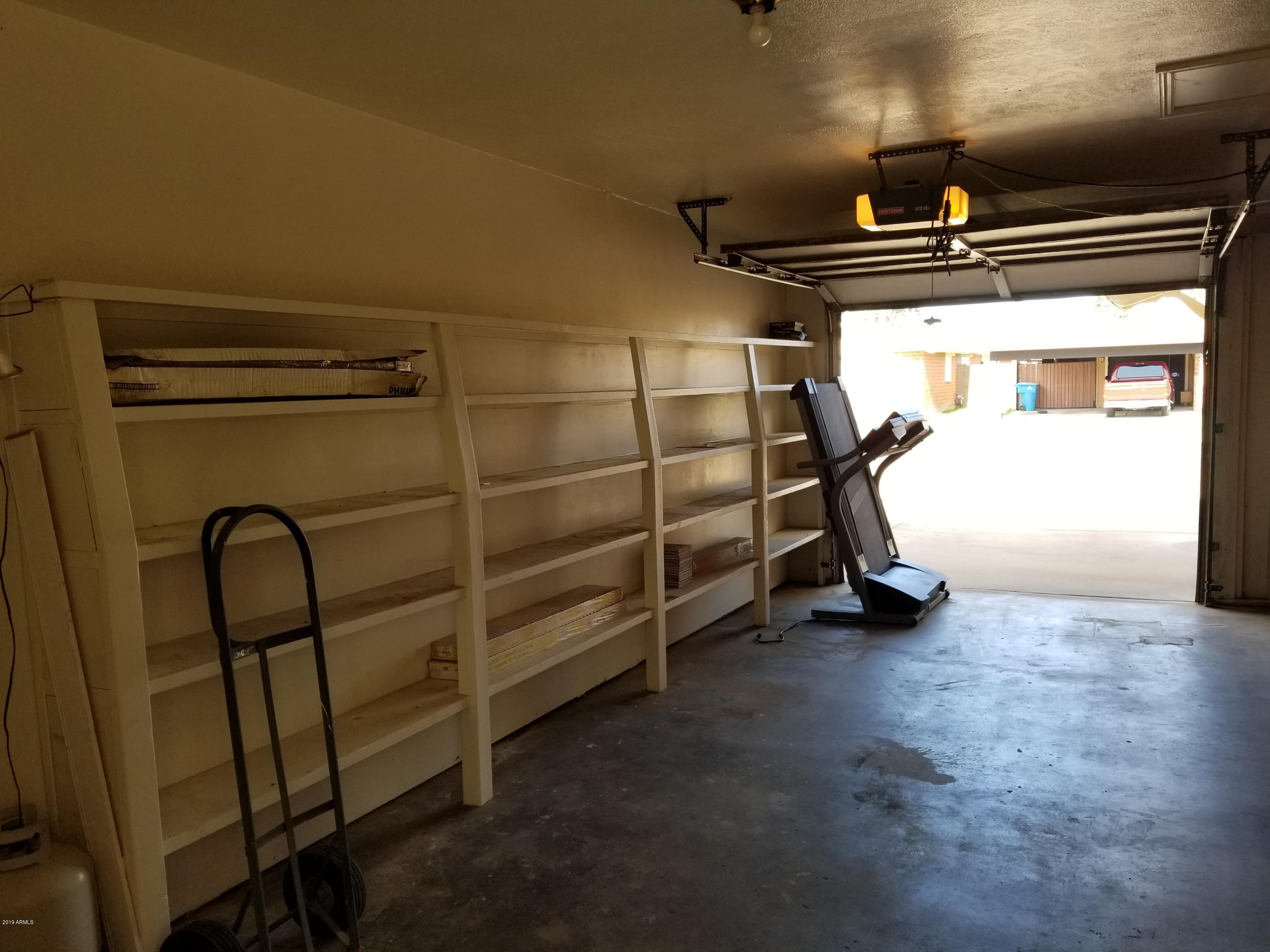 3507 West Lawrence Road Phoenix, AZ 85019 - Photo 3 of 16 Garage with Storage Shelves