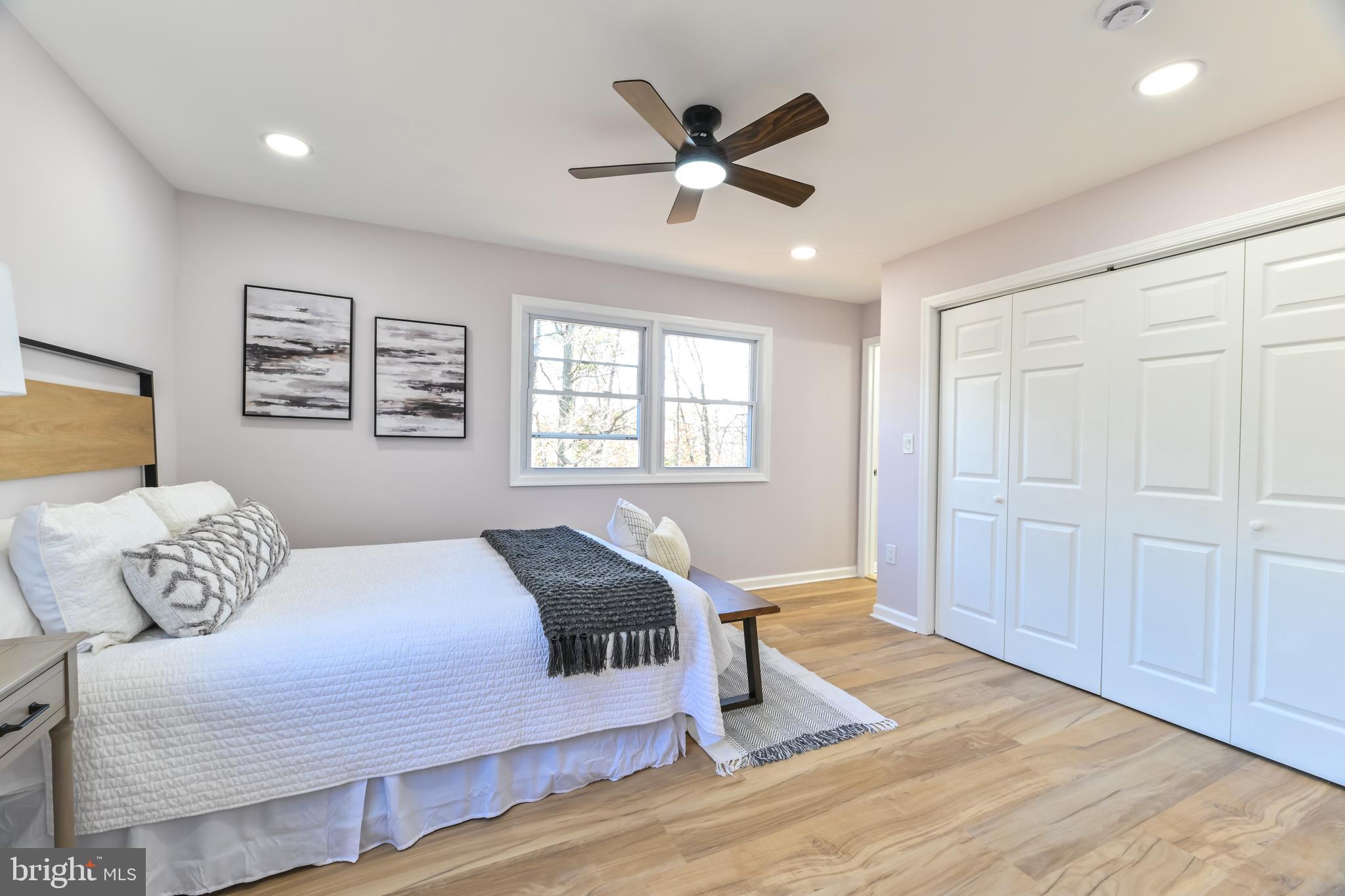 6716 Johnnycake Road Catonsville, MD 21228 - Photo 20 of 23 a bedroom with a large bed and a window