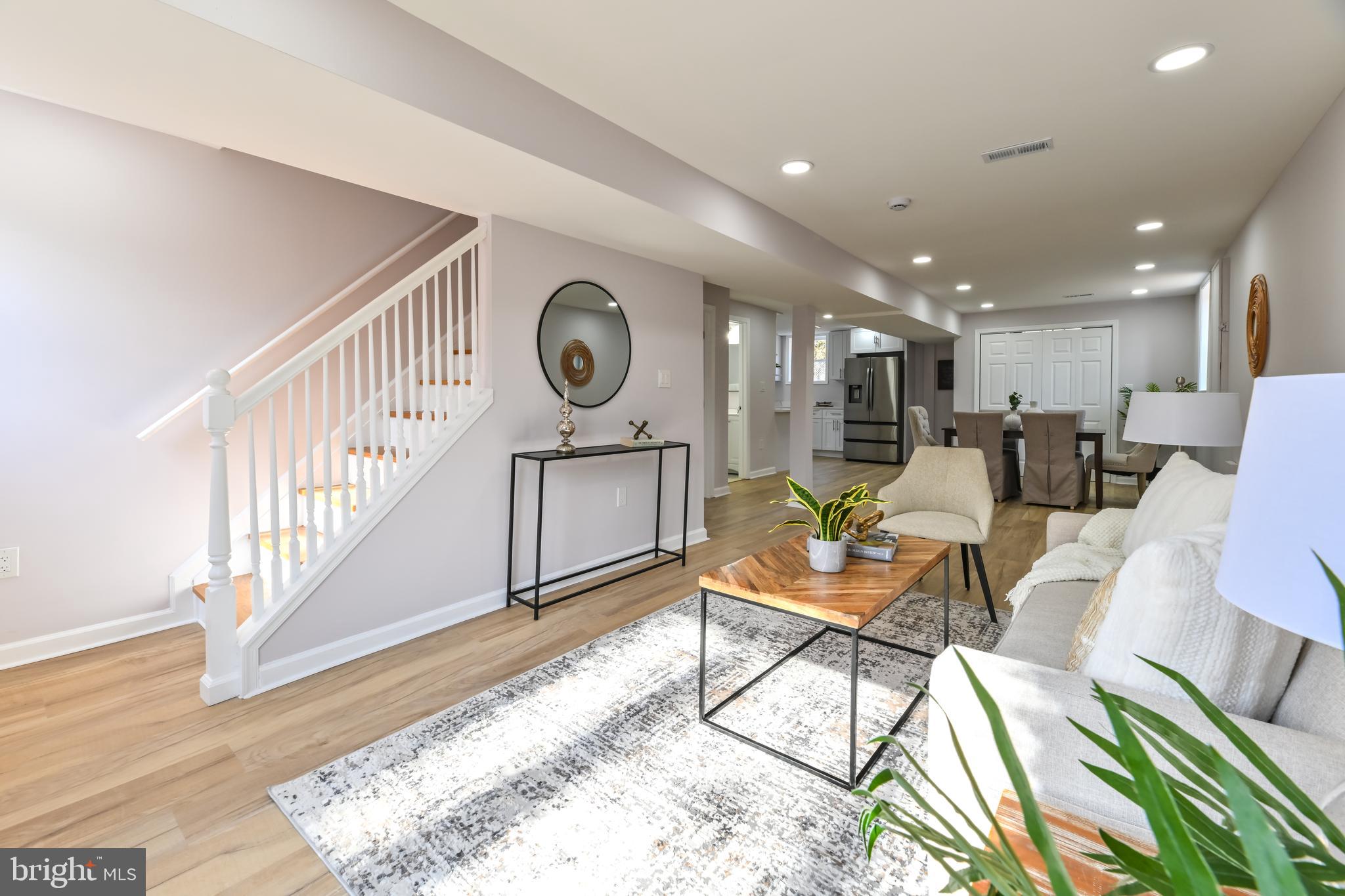 6716 Johnnycake Road Catonsville, MD 21228 - Photo 2 of 23 a living room with furniture and a wooden floor