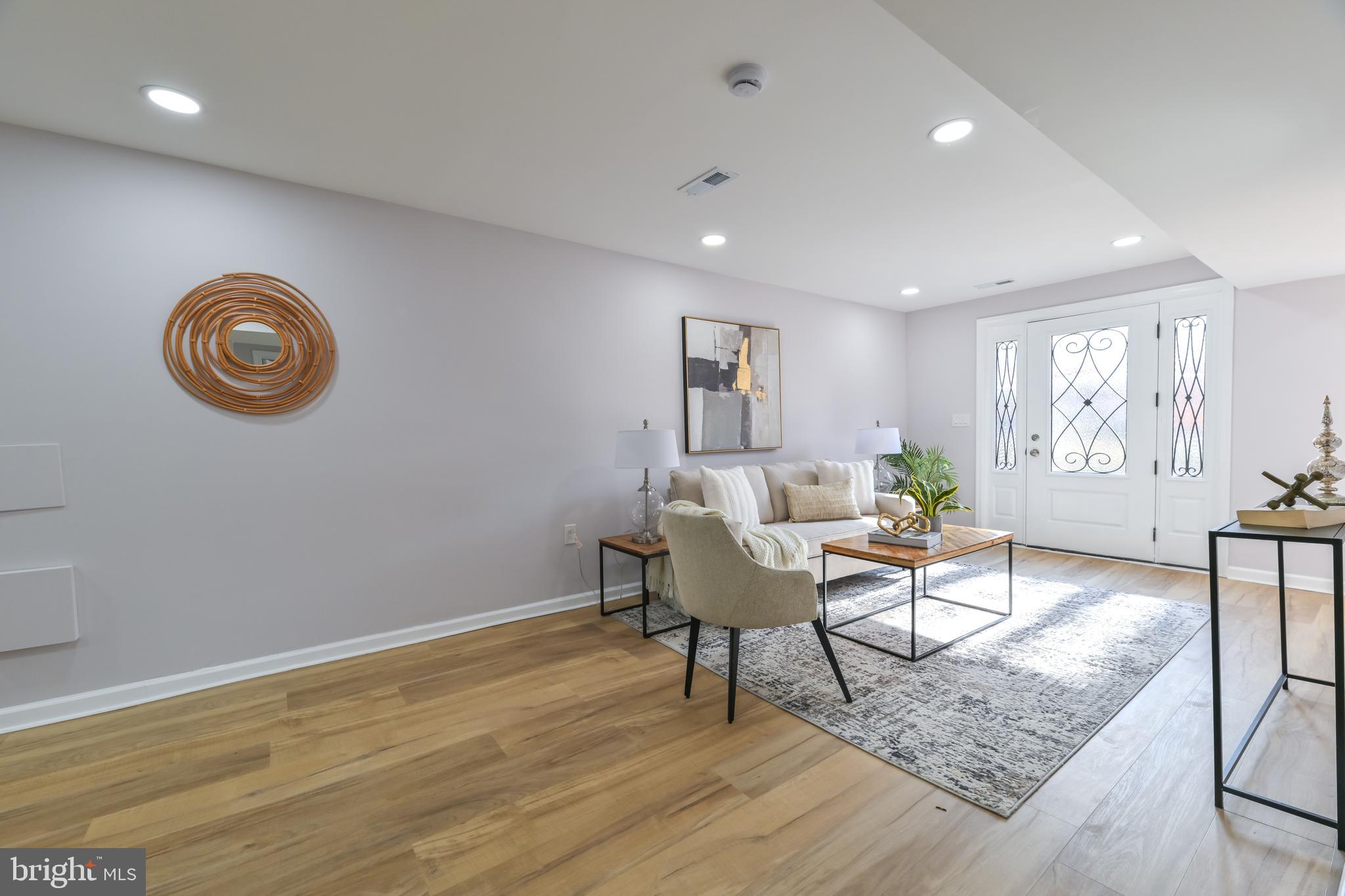 6716 Johnnycake Road Catonsville, MD 21228 - Photo 4 of 23 a view of a livingroom with furniture and a window