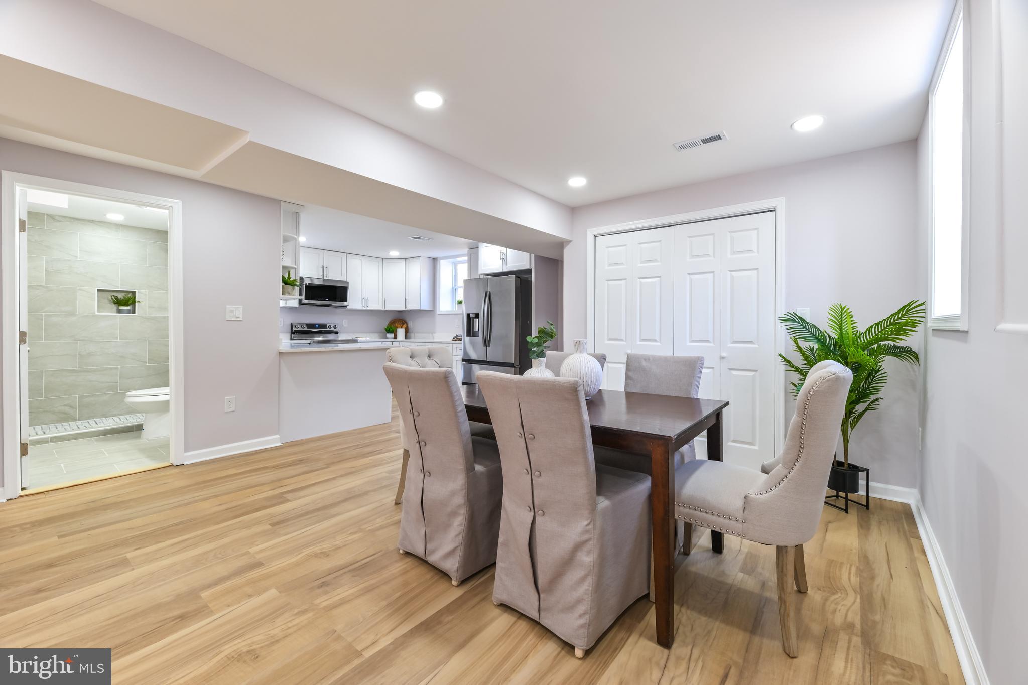 6716 Johnnycake Road Catonsville, MD 21228 - Photo 5 of 23 a view of a dining room with furniture and wooden floor