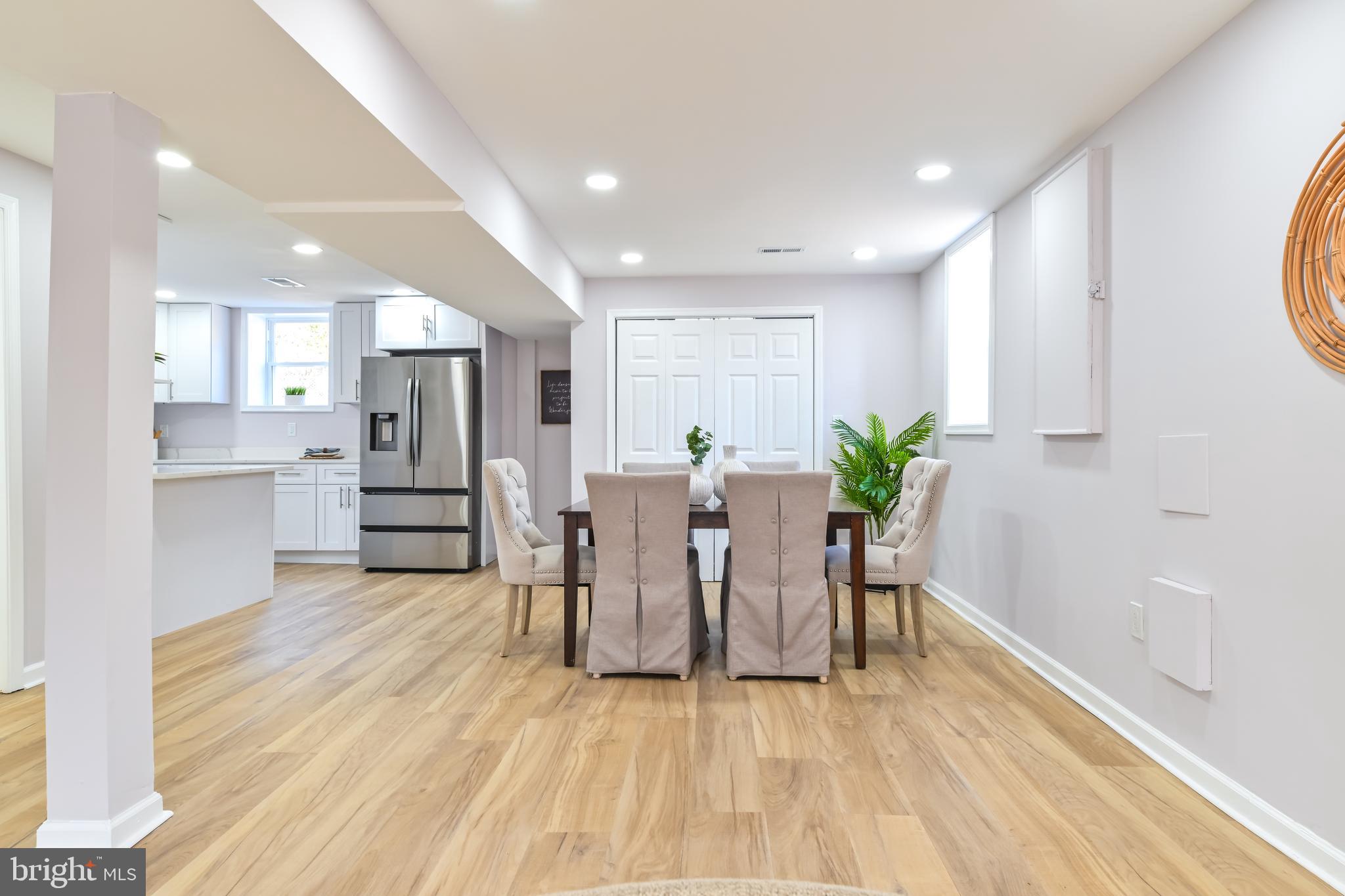 6716 Johnnycake Road Catonsville, MD 21228 - Photo 6 of 23 a view of kitchen with furniture and wooden floor