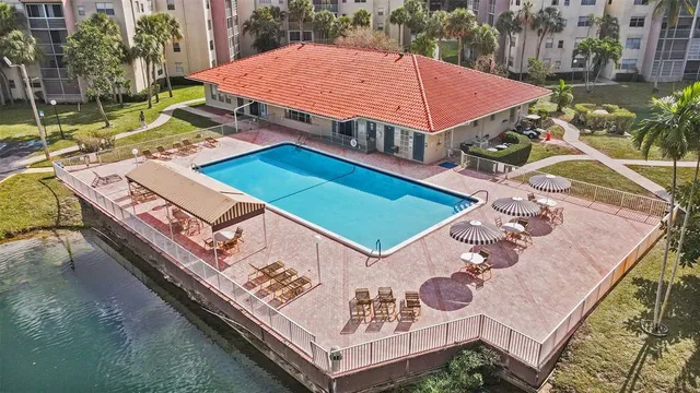 an aerial view of a house with a swimming pool