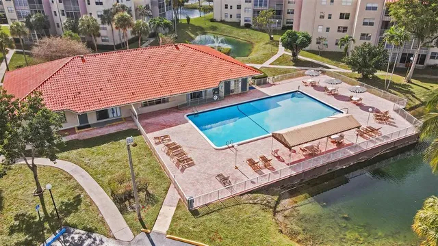 an aerial view of a house with a ocean view