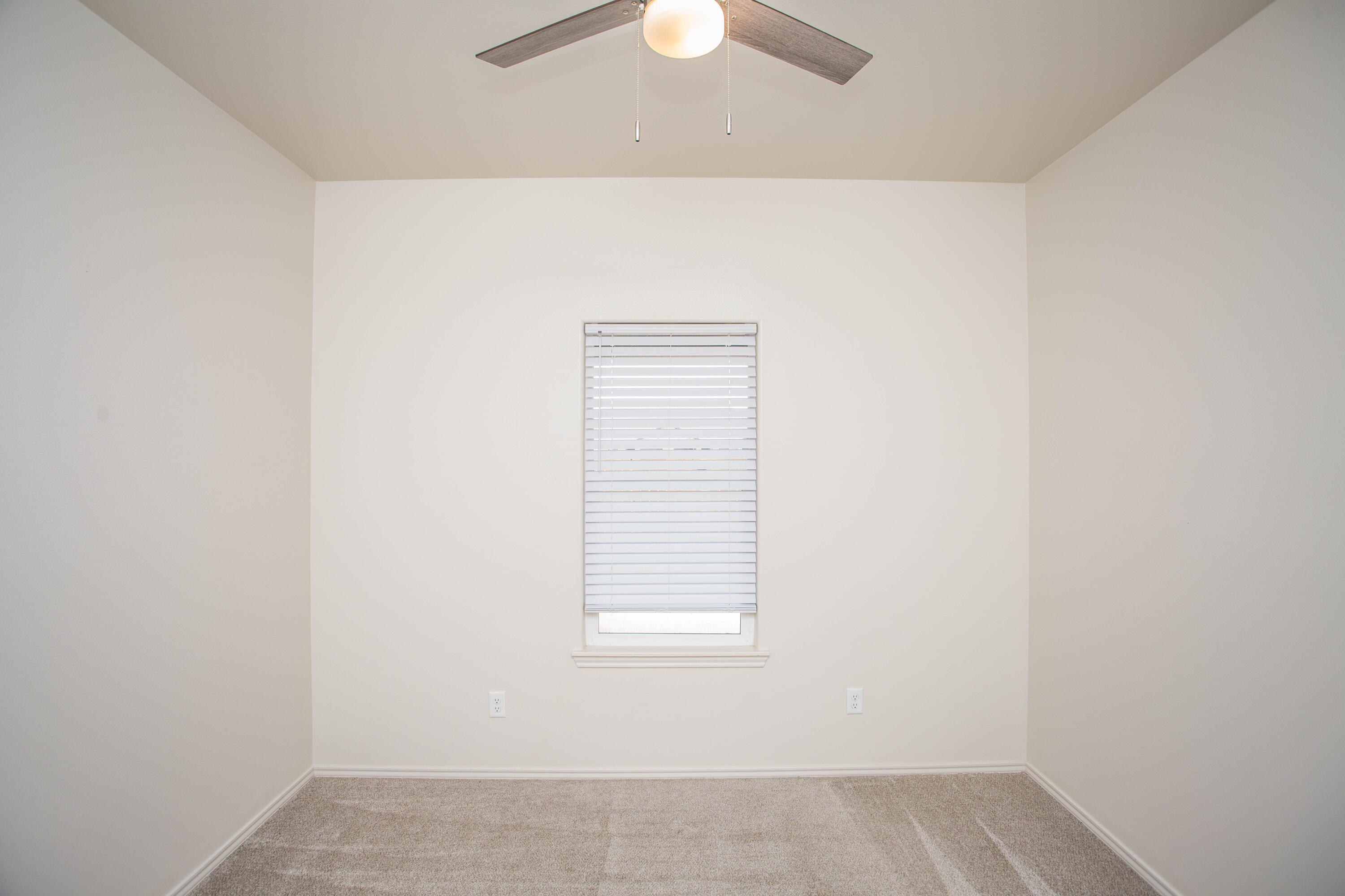5613 Kemper Street Lubbock, TX 79416 - Photo 19 of 35 an empty room with a window